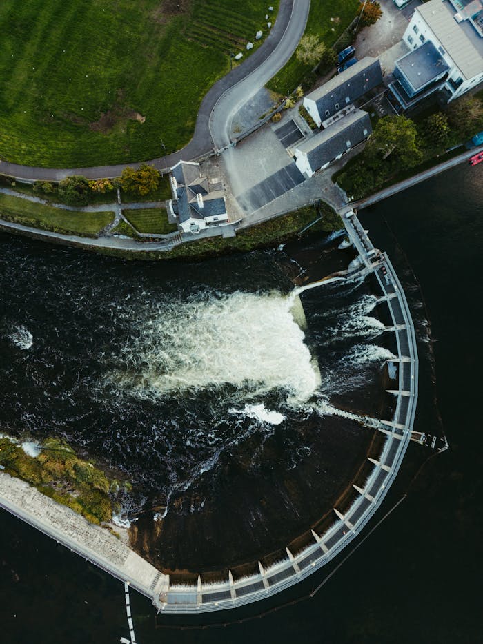 A stunning aerial view of a hydroelectric dam and flowing water in County Clare, Ireland.