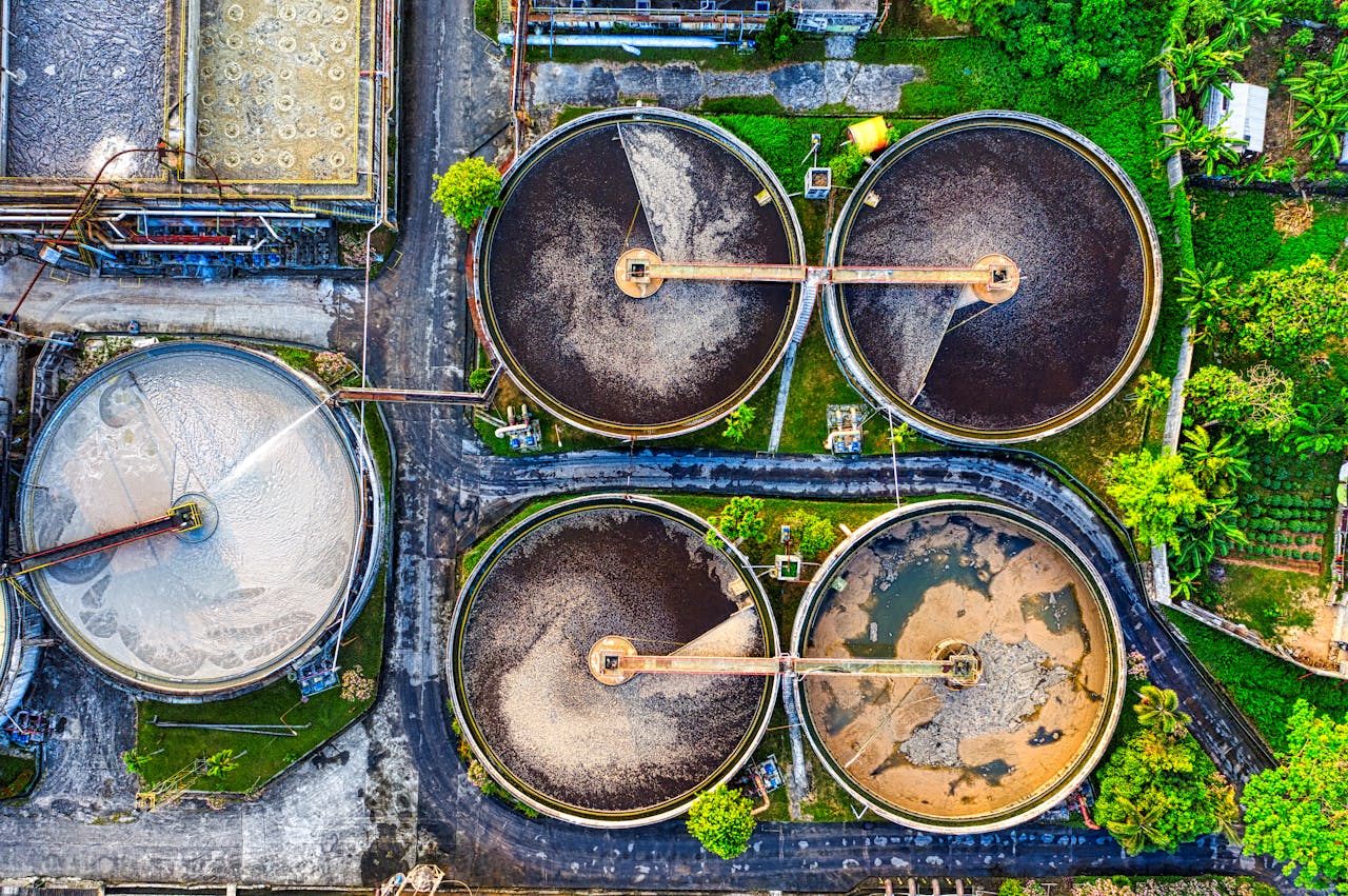 Aerial shot of a water treatment plant in Serang, Indonesia with circular tanks.